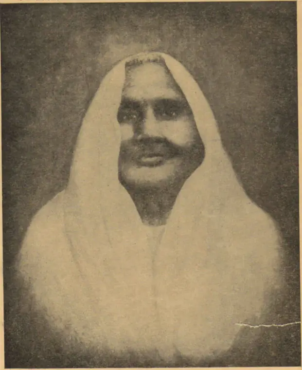 Archival halftone photograph of Matangini Hazra, an elderly woman with a white sari drawn over her head, looking towards the camera.